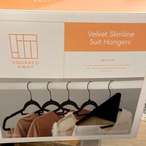 New box of velvet suit hangers.